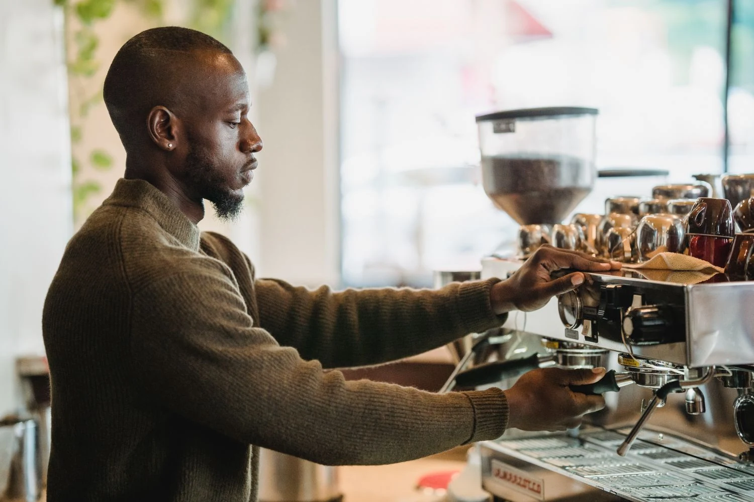 Barista pulling a shot at an espresso machine