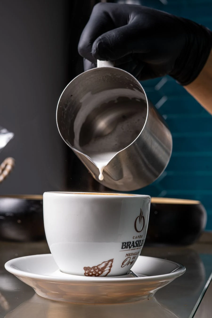 Pouring latte art into a cup